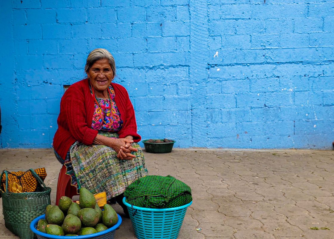 Guatemalan woman with avocados